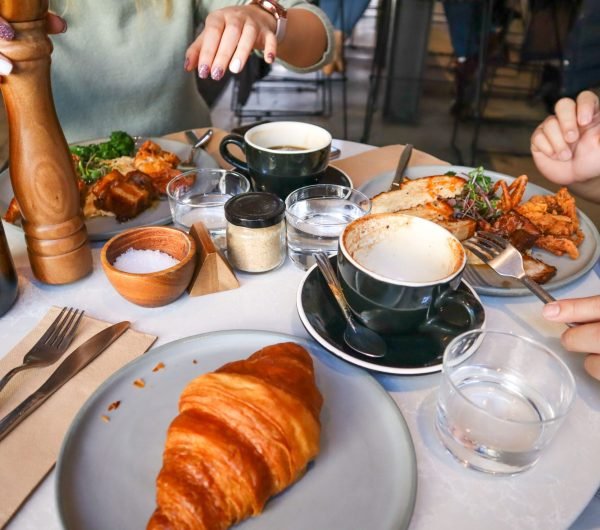 Coffee and breakfast spread at a cozy Delhi cafe for students